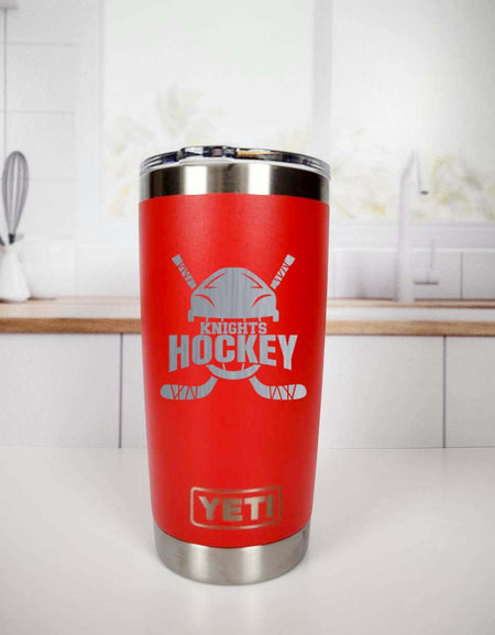 a red yeti cup sitting on top of a counter