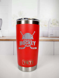 a red yeti cup sitting on top of a counter